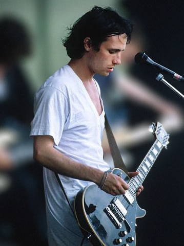 Jeff Buckley plays his guitar during a performance in 1994.