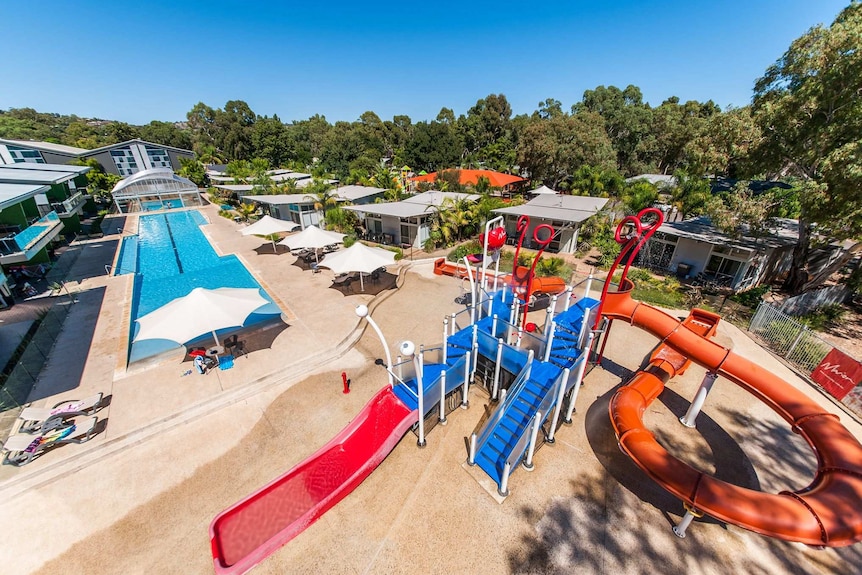 A pool and slides outside of the Marion Holiday Park