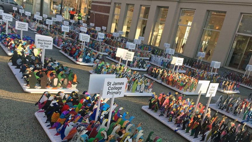 Colourful cut out penguins on display for sale on Hobart's waterfront