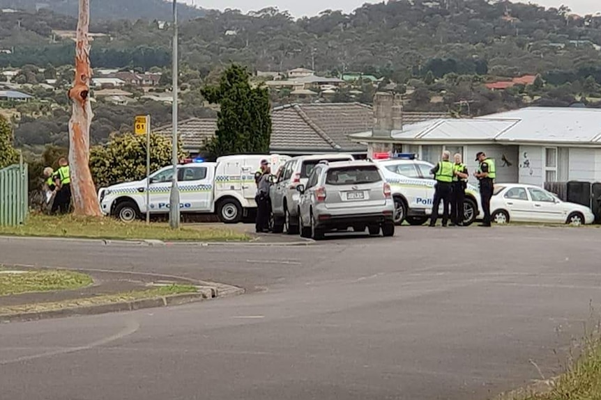 Police cars and officers surround a house in Bridgewater, after a man was shot in a drive-by shooting.