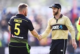 Aaron Finch shakes hands with Kane Williamson after a T20 international in Dunedin.
