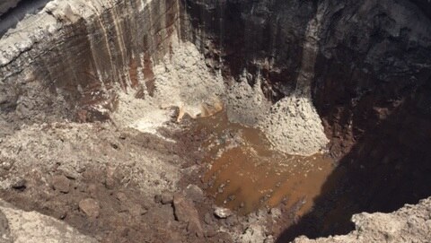 Soil pit with groundwater in the bottom on Gold Coast Airport construction site