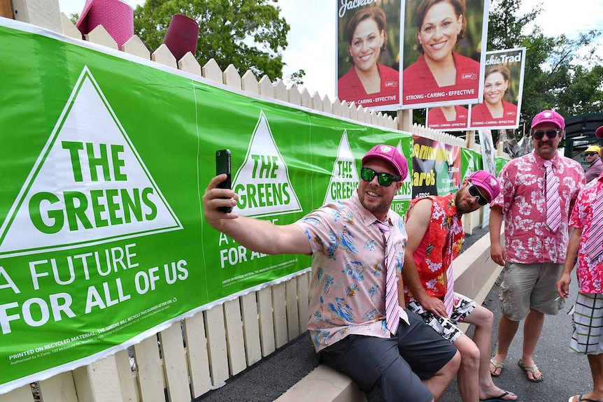Cricket fans seen posing for a selfie outside East Brisbane State School polling booth as people vote in the Queensland election