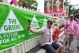 Cricket fans seen posing for a selfie outside East Brisbane State School polling booth as people vote in the Queensland election