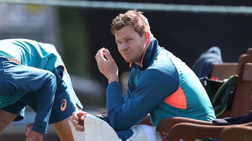 Australia cricketer Steve Smith sits with his finger bandaged after copping a hit at training before the Ashes.