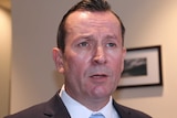 A close-up head shot of WA Premier Mark McGowan indoors.