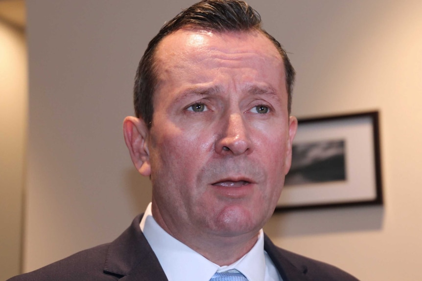 A close-up head shot of WA Premier Mark McGowan indoors.