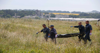 Bodies removed from MH17 crash site