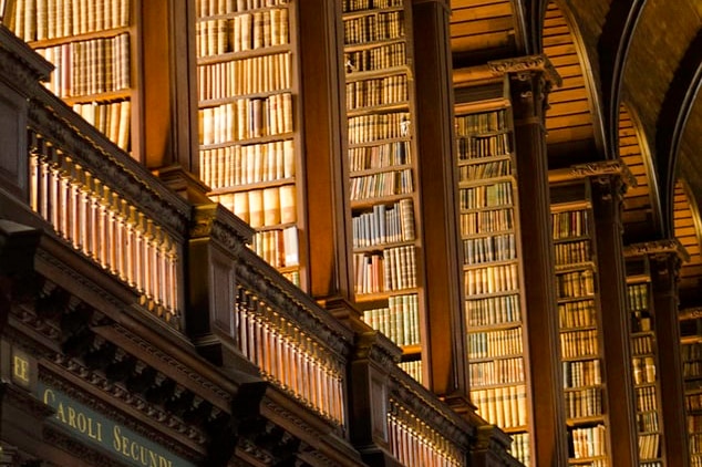 Rows of books are seen at Trinity College Library, in Dublin