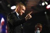 Richmond's Dustin Martin gesturing after winning the 2017 Brownlow Medal.