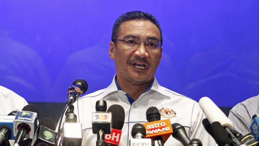 Malaysia transport minister Hishamuddin Hussein addresses media