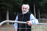 Roger Poltock smiling on his property