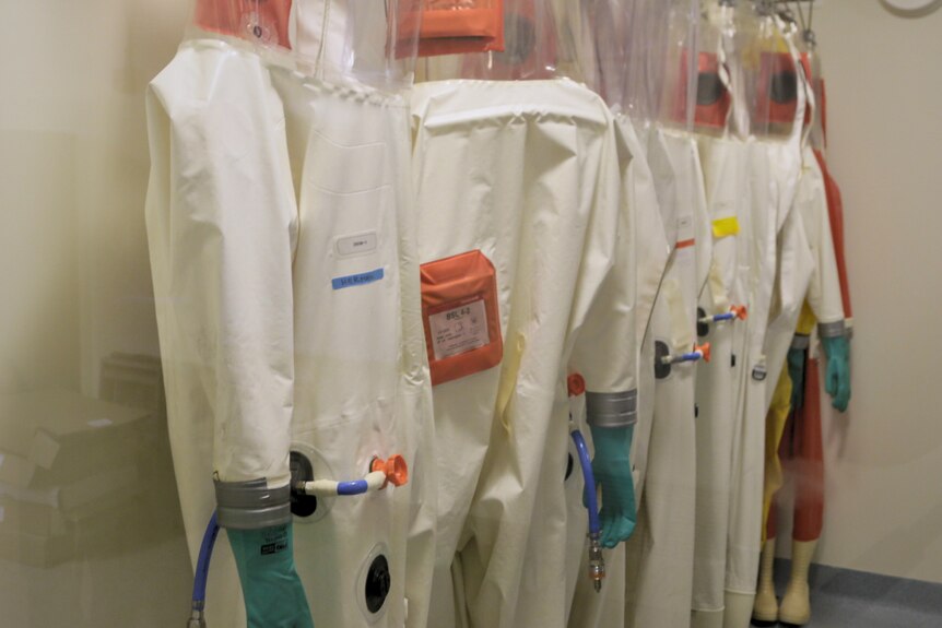 Protective suits hanging in a room at the Centre for Diseased Preparedness.