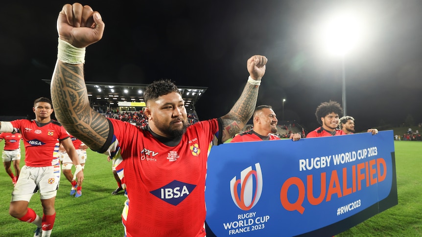 Tonga male rugby players celebrate after qualifying for the 2023 Rugby World Cup.