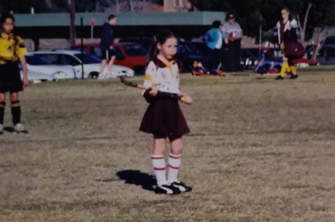 A grainy old photo of Lily Brazel in the uniform of her junior hockey team.