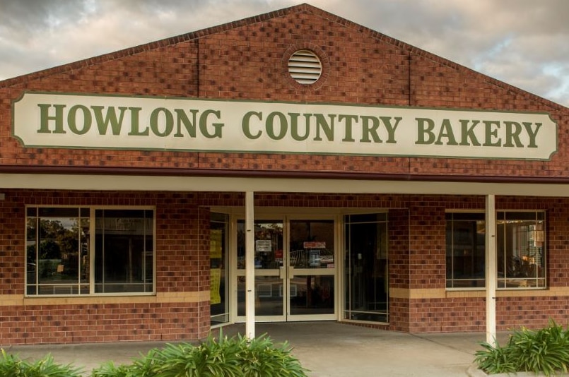 A brick shopfront that says Howlong Country Bakery.
