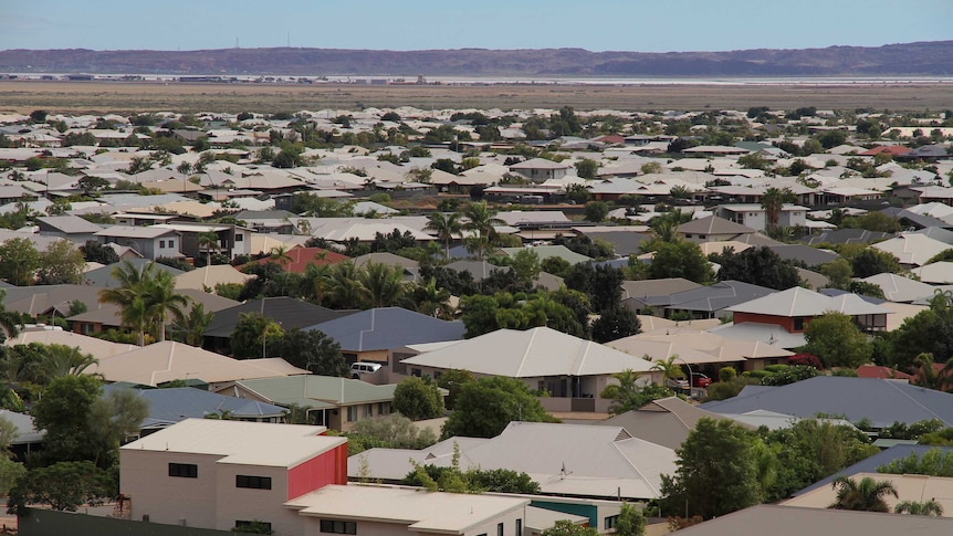 Houses in front of hills