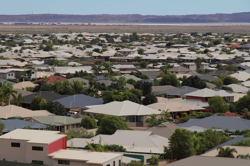 houses in front of hills