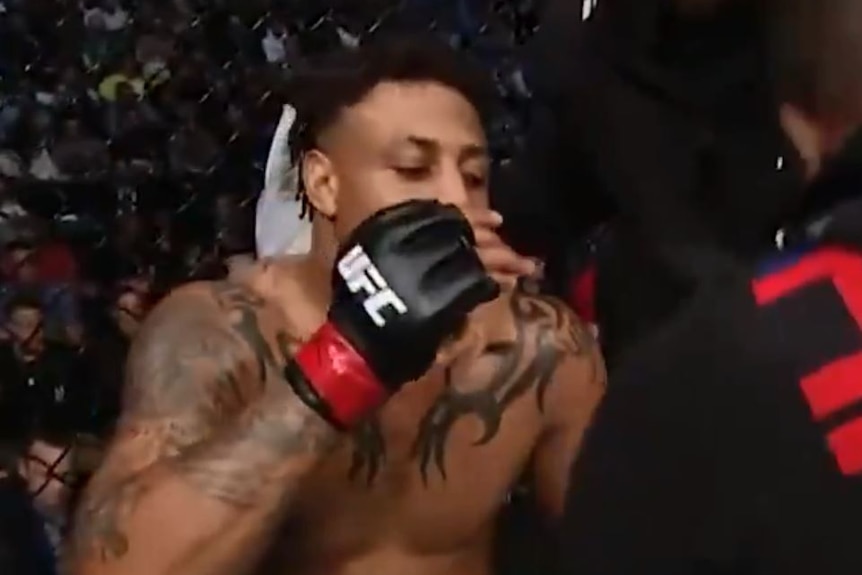 In a screenshot of a Twitter video, Greg Hardy uses an asthma puffer during a UFC fight.