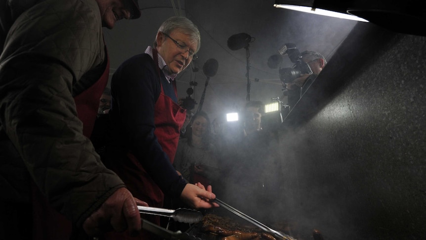 Prime Minister Kevin Rudd cooks a barbecue with Holden workers in Salisbury, near Adelaide.