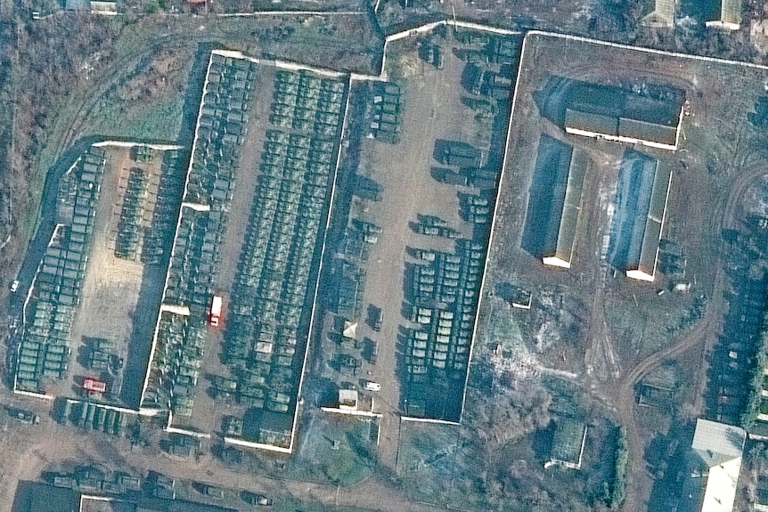 satellite images show troops gathered on the ground