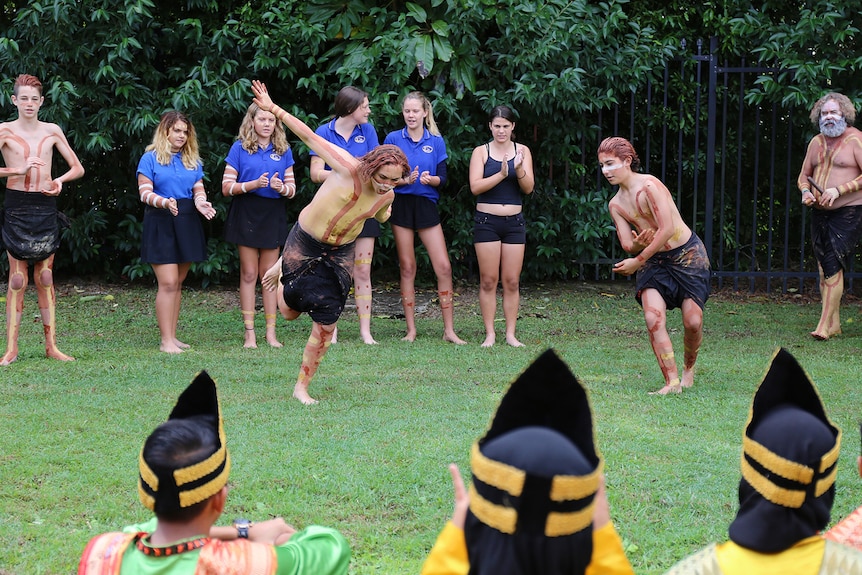 Indonesian students watching Aboriginal dancers
