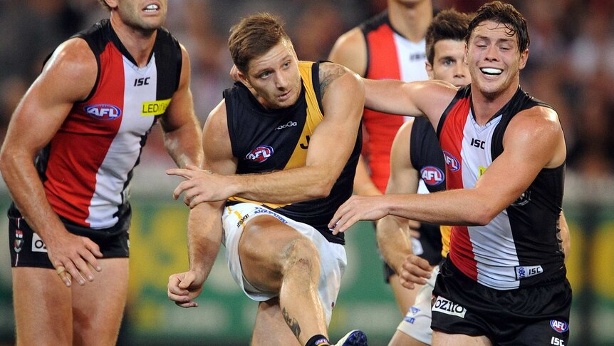 Richmond's Ricky Petterd clears the ball from the back line against St Kilda at the MCG.