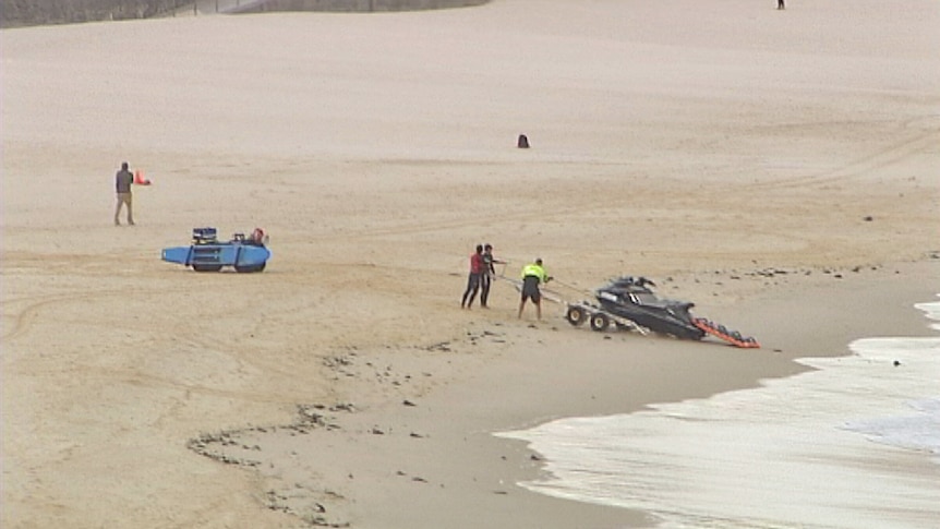 TV still of lifeguards on Bondi Beach