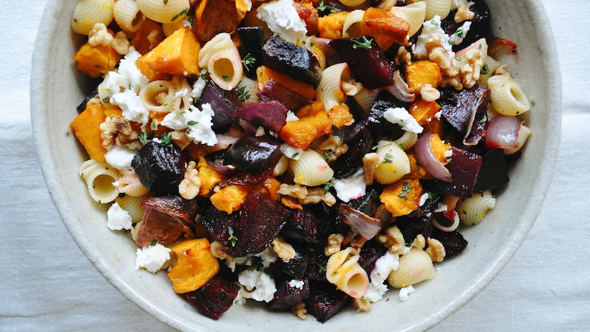 Pasta shells in a salad with roast pumpkin, beetroot, goats cheese, red onion and thyme vinaigrette, a vegetarian family recipe.