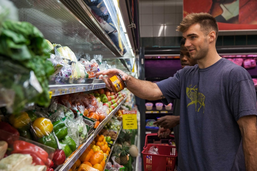 Goldfields Giants players Patrick Burke and Jay Bowie shop for groceries in Kalgoorlie, WA.