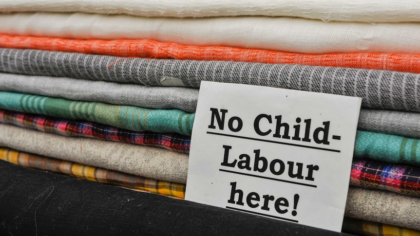 Sign at a cloth shop advising customers the no child labour is used in the production of their goods.