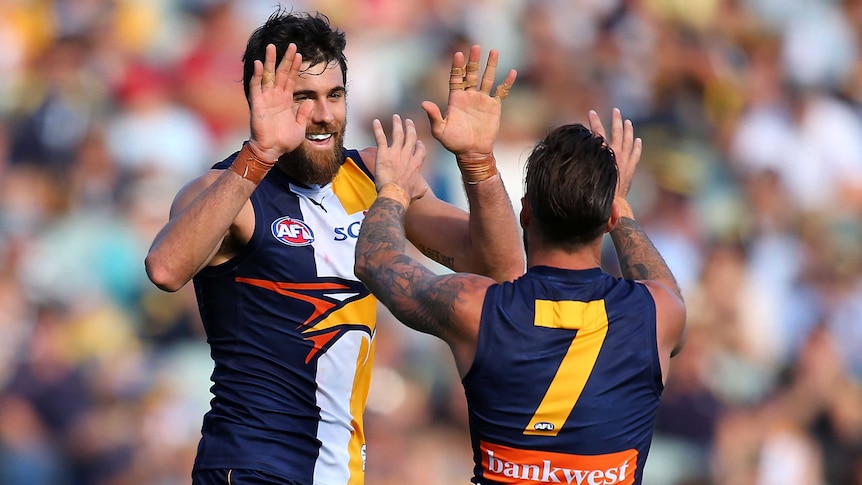 West Coast Eagle Josh Kennedy celebrates a goal with Chris Masten against GWS at Subiaco Oval.