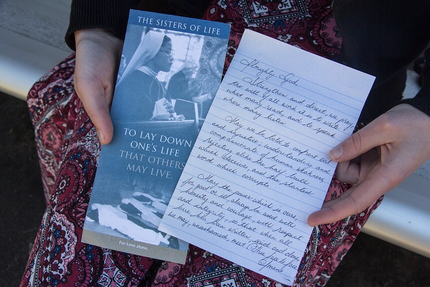 Nancy Webb holds the leaflet she was handed for Sisters of Life.