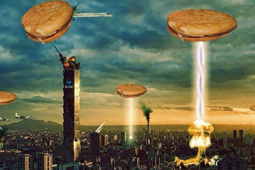 Burgers appear as flying sauces shooting laser beams onto a city.