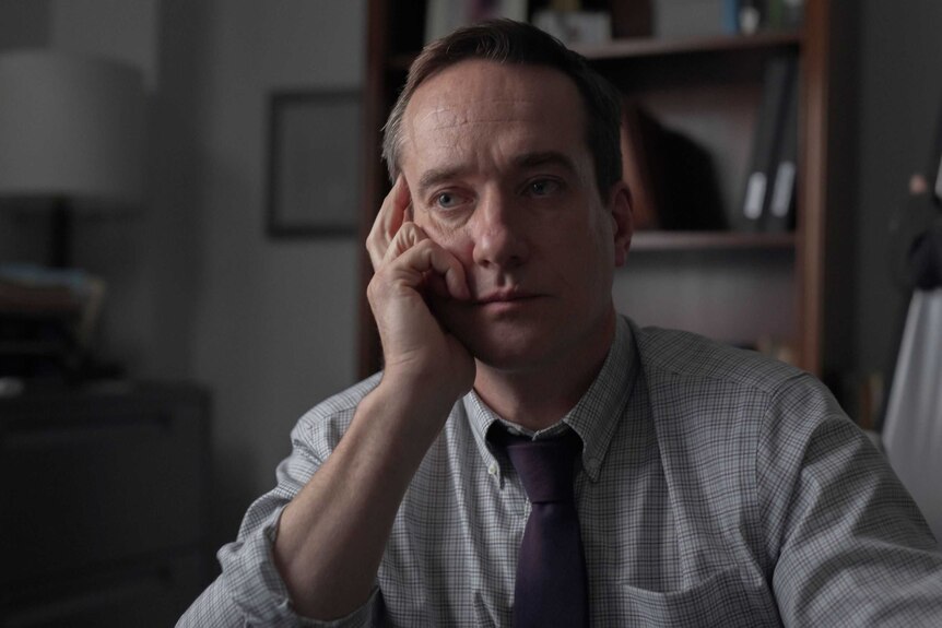 Actor Matthew Macfadyen in the film The Assistant, playing an HR boss in a shirt and tie