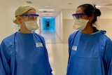 two physios in PPE in a hospital