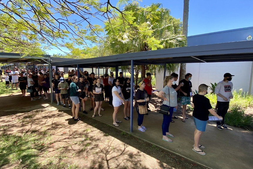 Fifty-eight Queensland schools are involved in the vaccine rollout as people line up at Bray Park State High