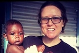 Territorian Emma Bell who was on board MH17 holding an Indigenous child