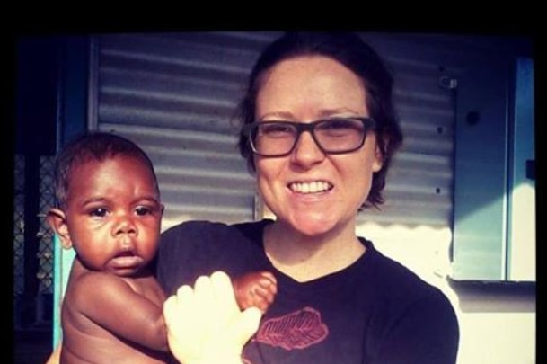 Territorian Emma Bell who was on board MH17 holding an Indigenous child