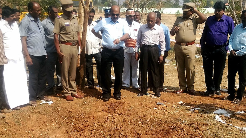 Indian authorities inspect the site of a suspected meteorite landing.