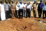 Indian authorities inspect the site of a suspected meteorite landing.