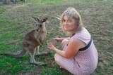 Louise Krieger feeds a rescued kangaroo for a story about how her experiences being single after divorce.