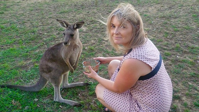 Louise Krieger feeds a rescued kangaroo for a story about how her experiences being single after divorce.