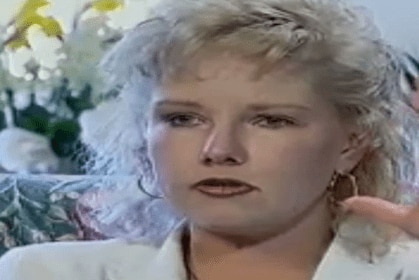 A woman appears on a television show.