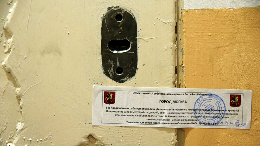 The office door of rights group Amnesty International is sealed off in Moscow.