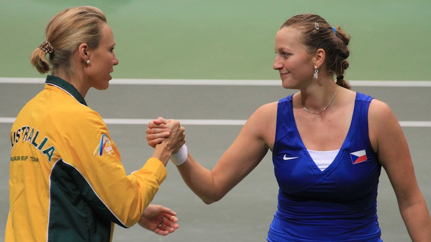 Samantha Stosur shakes hands with Czech Republic's Petra Kvitova after their Fed Cup match.