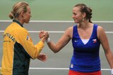 Samantha Stosur shakes hands with Czech Republic's Petra Kvitova after their Fed Cup match.