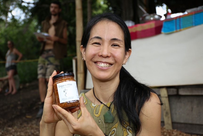 Tomoko Nishi holds a jar of miso