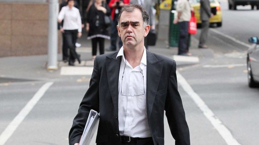 Opes Prime's Julian Smith leaves the Melbourne Magistrate court