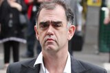 Opes Prime's Julian Smith leaves the Melbourne Magistrate court